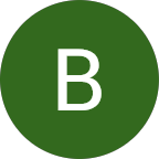 A large white capital letter B is centered within a dark green circular field.