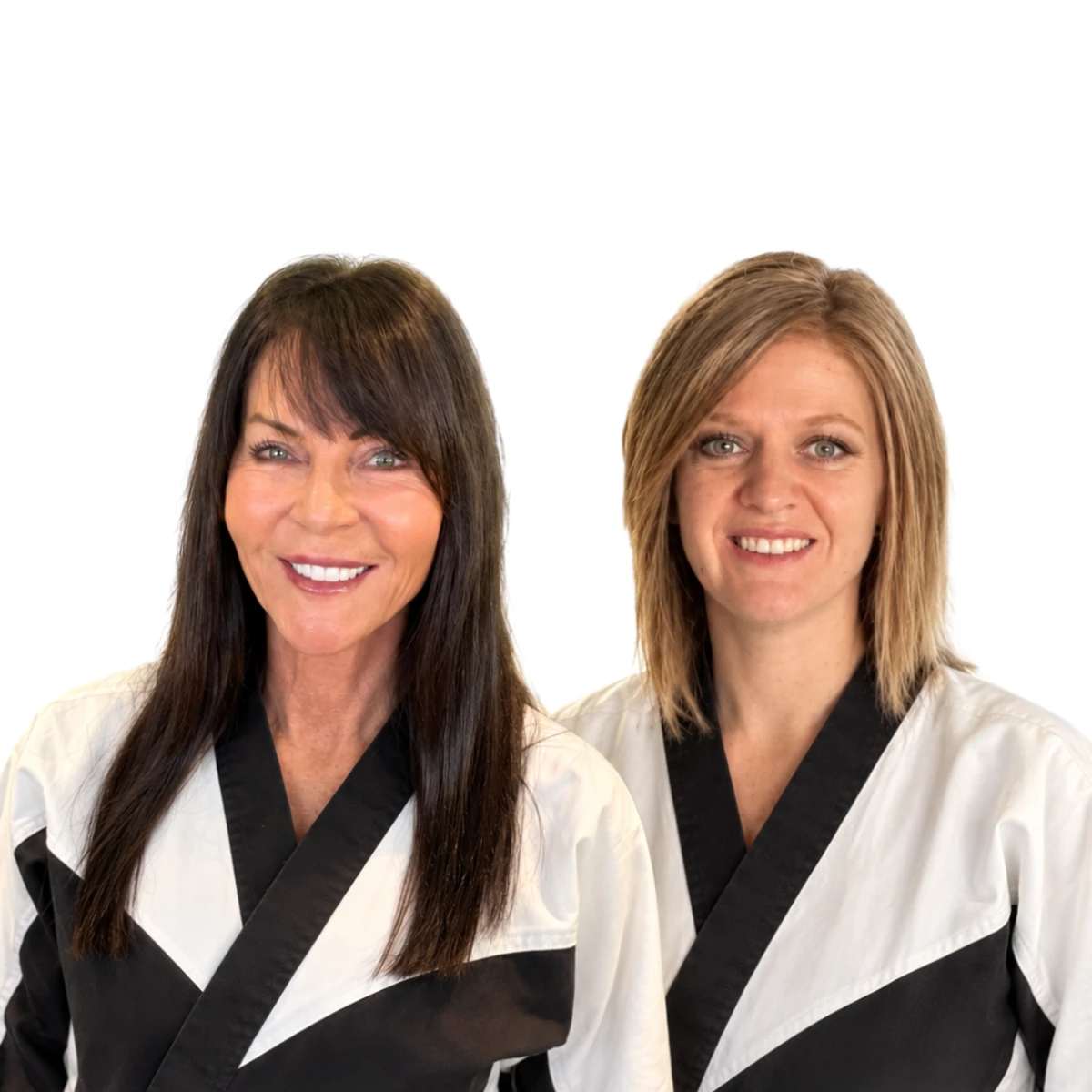 Karate instructors Jan and Katie smile confidently at the camera while wearing black and white uniforms.